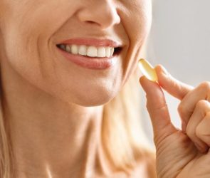 Beauty Supplements. Closeup Smiling Woman