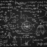 Image of math equations written on a blackboard.