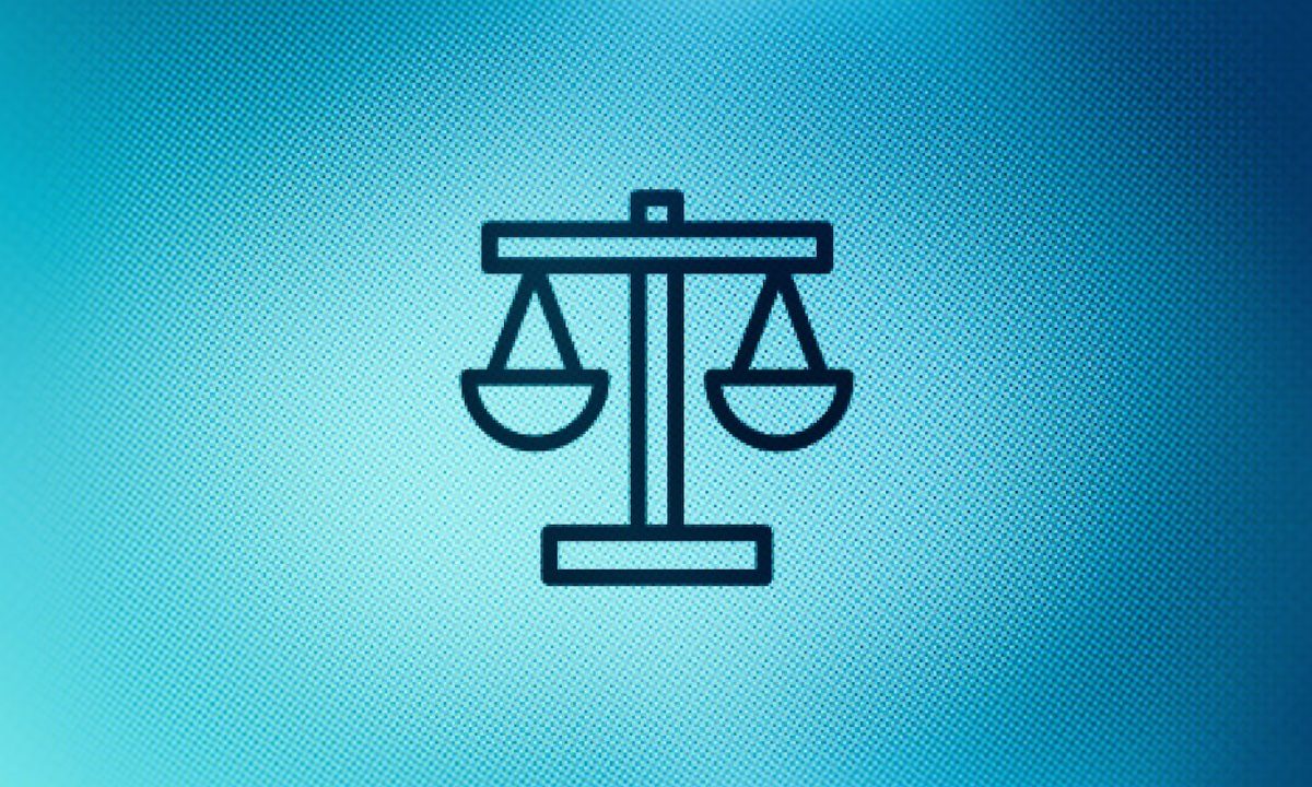 Close up of justice scales icon on screen