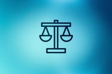 Close up of justice scales icon on screen