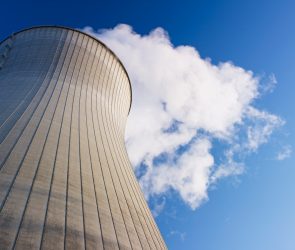 Cooling tower at nuclear power plant emits steam.