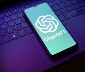 The ChatGPT logo appears on a smartphone screen