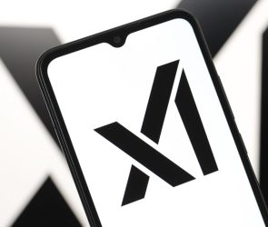 The xAI logo displayed on a smartphone screen.