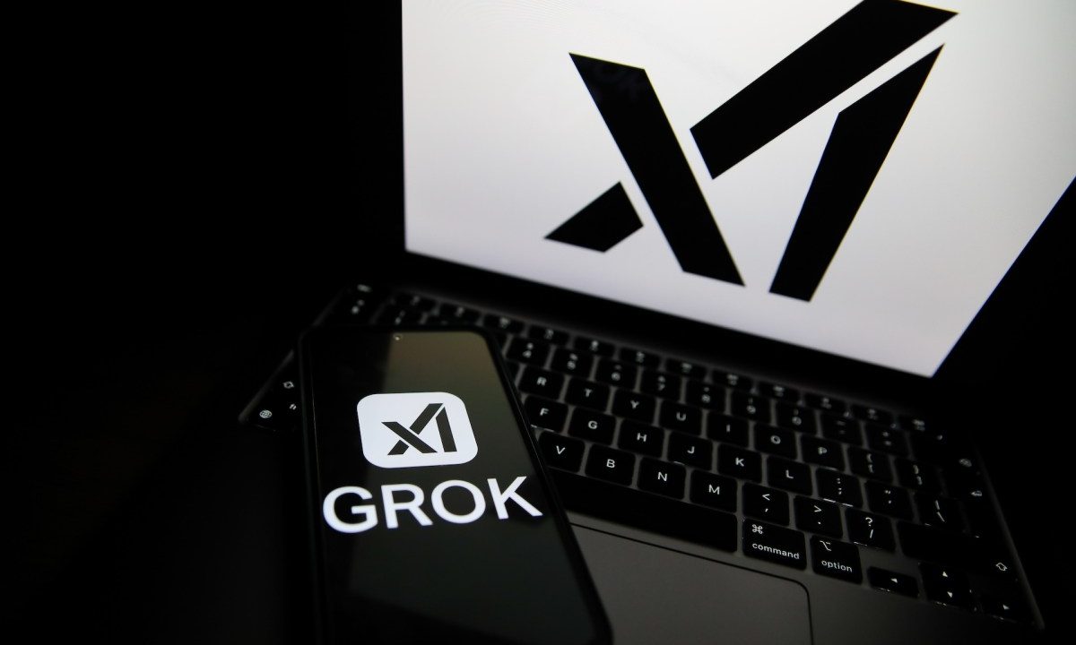 The Grok logo appears on a phone and the xAI logo is displayed on a laptop.