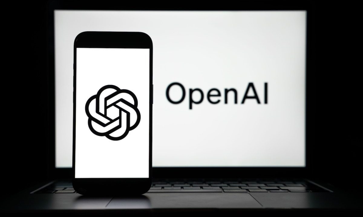 the logos of Open AI displayed on both computer and smart phone screen