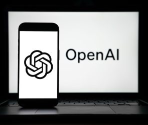 the logos of Open AI displayed on both computer and smart phone screen