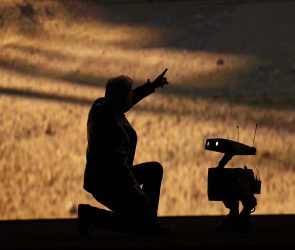 Nvidia founder and CEO Jensen Huang talks to a robot as he speaks during Nvidia Live at CES 2026 ahead of the annual Consumer Electronics Show in Las Vegas, Nevada, on January 5, 2026.