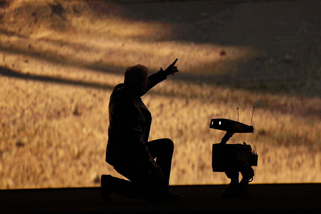 Nvidia founder and CEO Jensen Huang talks to a robot as he speaks during Nvidia Live at CES 2026 ahead of the annual Consumer Electronics Show in Las Vegas, Nevada, on January 5, 2026.