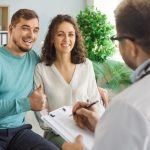Happy Couple Doctor Clinic Pregnancy Planning