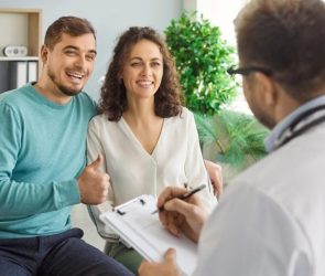 Happy Couple Doctor Clinic Pregnancy Planning