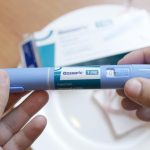 Holding Semaglutide Ozempic Injector Pen in Hands