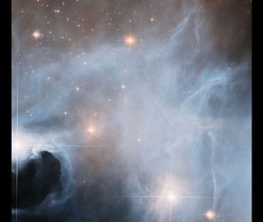 Hubble spots three young stars going through growth spurts