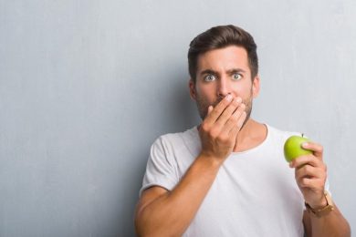 Man Eating Apple Surprised