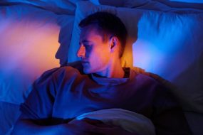 Man Sleeping in Bed Hot Heat