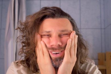 Tired Exhausted Delirious Long Haired Man Touching Face