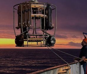 Workers on the RRS Discovery Lower a Sensing Instrument Into the Southern Atlantic Ocean