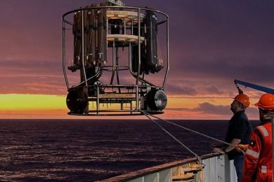 Workers on the RRS Discovery Lower a Sensing Instrument Into the Southern Atlantic Ocean