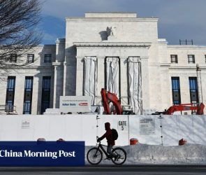 US Federal Reserve holds interest rates steady, defying Trump pressure