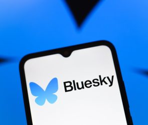 Bluesky logo appears on the screen of a smartphone