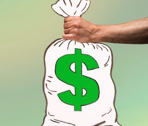 Man's hand holding an illustrated money bag with US dollar sign