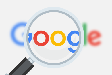 Magnifying glass over Google logo