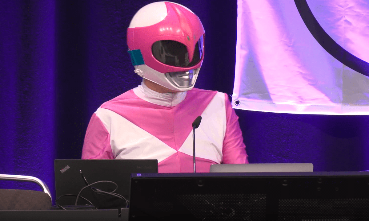 Hacker Martha Root on the stage of the Chaos Communication Congress (39C3) in Hamburg, Germany, an annual cybersecurity conference.