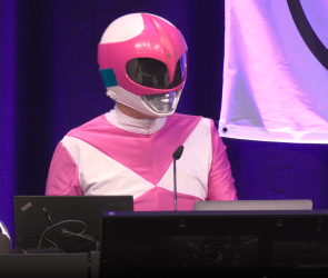 Hacker Martha Root on the stage of the Chaos Communication Congress (39C3) in Hamburg, Germany, an annual cybersecurity conference.