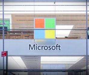 A Microsoft store entrance with the company's logo on top in midtown Manhattan