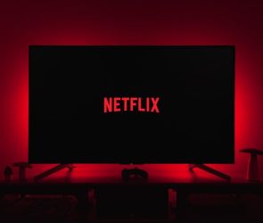 netflix logo on black screen backlit by red glow