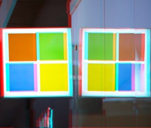 a moshed/glitchy version of a Windows logo on a Microsoft Store front