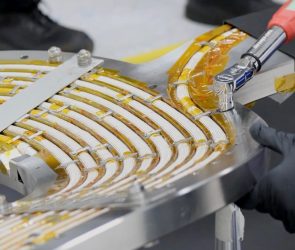 An engineer works on a high-temperature superconducting magnet.