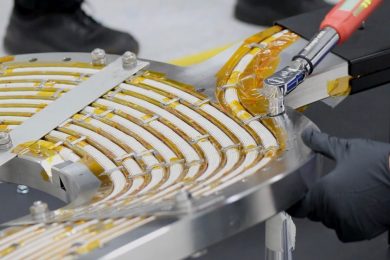 An engineer works on a high-temperature superconducting magnet.