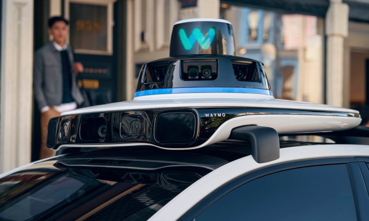 A close up of the rooftop of a Waymo robotaxi that shows sensors.
