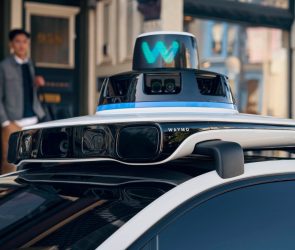 A close up of the rooftop of a Waymo robotaxi that shows sensors.