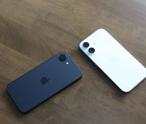 Two Apple iPhone 16e units splayed on table