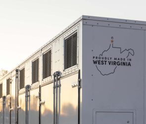 A grid-scale battery stands against a clear sky.