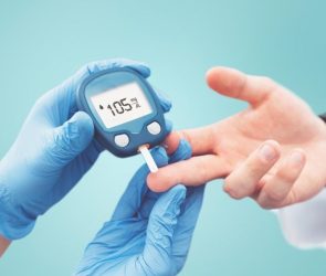 Fitness Diabetes Doctor Holding Glucose Test Meter