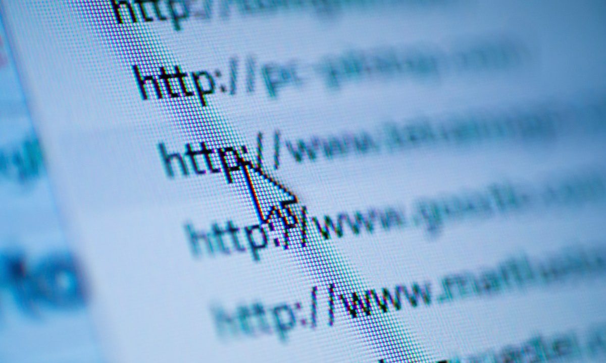 Cursor arrow pointing at URL on screen