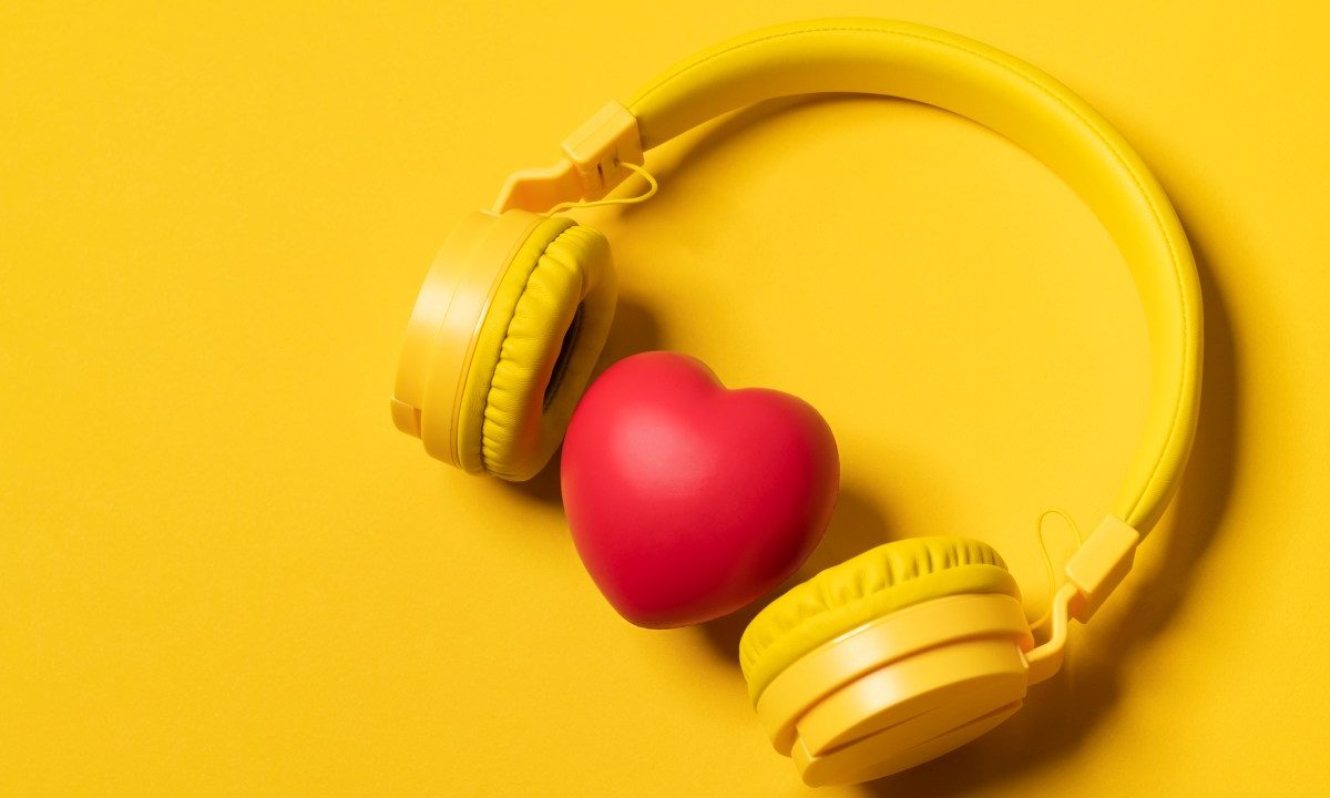 Yellow Headphones On Yellow Background And A Heart