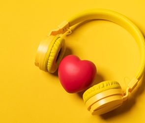 Yellow Headphones On Yellow Background And A Heart