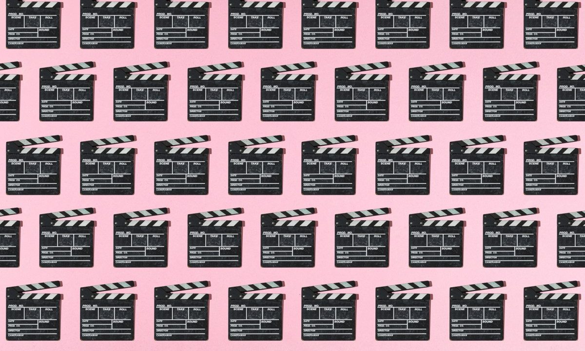 Wooden old movie clapperboard pattern with hard shadow on pink background. Concept of film industry, cinema, entertainment, and Hollywood.