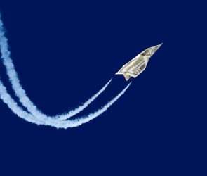 Dollar shaped paper airplane flying up