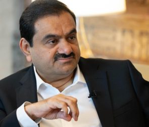 Gautam Adani, chairman of Adani Group, sits during a television interview.