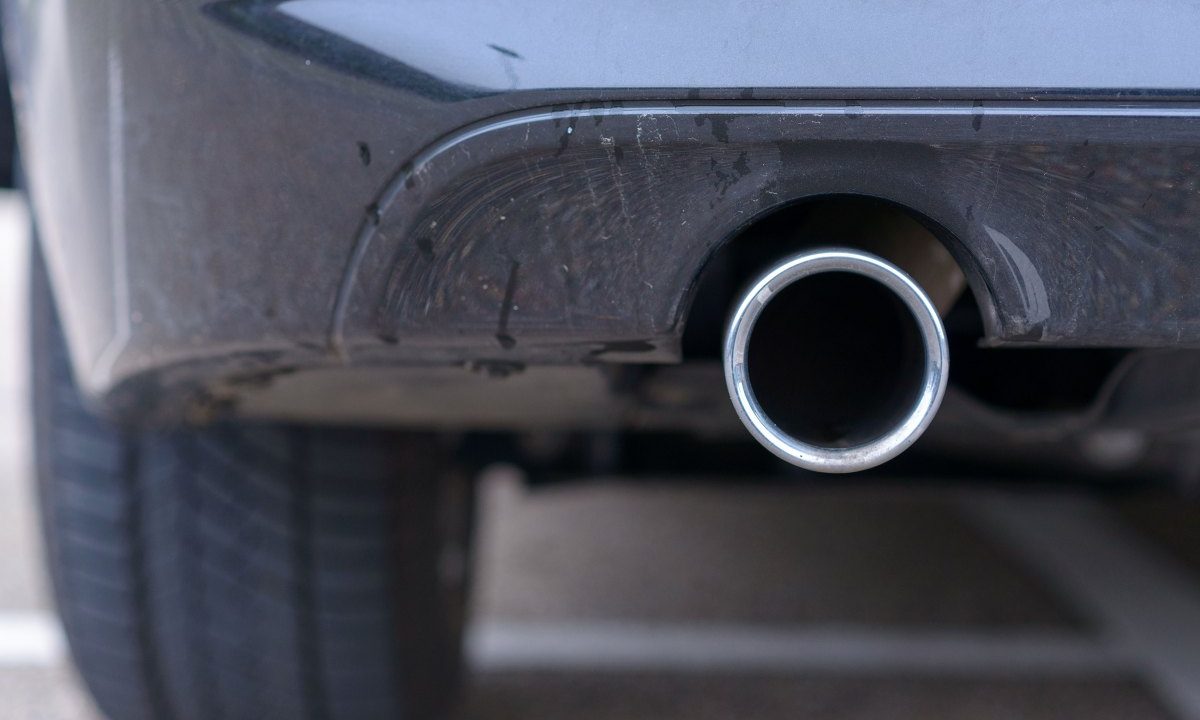 Low angle view of an exhaust pipe on a car.