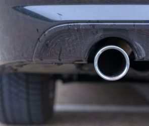 Low angle view of an exhaust pipe on a car.