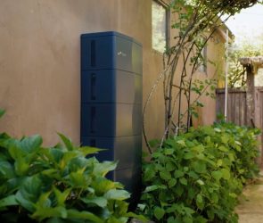 A stationary battery is attached to a home.