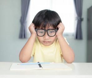 Young Boy Struggling Learning School Homework