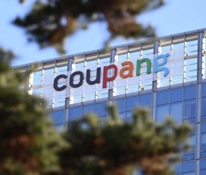 A general view shows the logo of South Korean online delivery service Coupang, at a building housing the headquarters of Coupang in Seoul on December 9, 2025. South Korean police raided the Seoul headquarters of e-commerce giant Coupang on December 9, over a recent data leak believed to have affected almost two-thirds of the country's population.