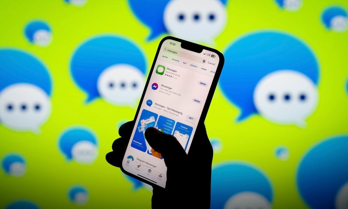 Apple iMessage app and logo are seen in this photo illustration