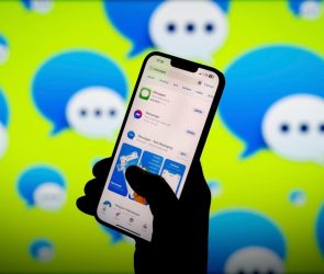 Apple iMessage app and logo are seen in this photo illustration